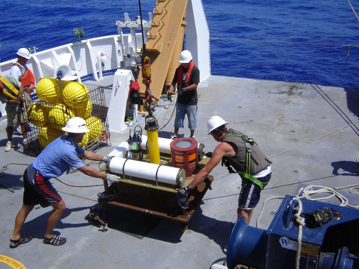 technical crew servicing a buoy aboard a ship