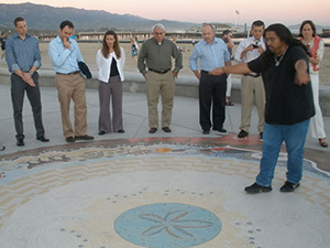 Chumash interpreter telling the story of Syuxtun Story Circle in Santa Barbara, CA